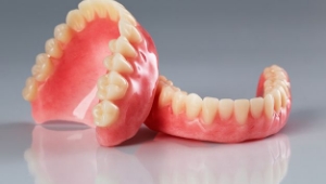 upper and lower prosthetic dentures for a full mouth restoration